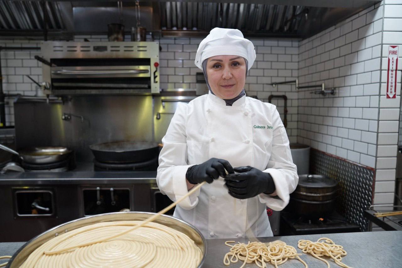 Gulnoza Jurayeva hand-stretching noodles in the Laghman Express kitchen